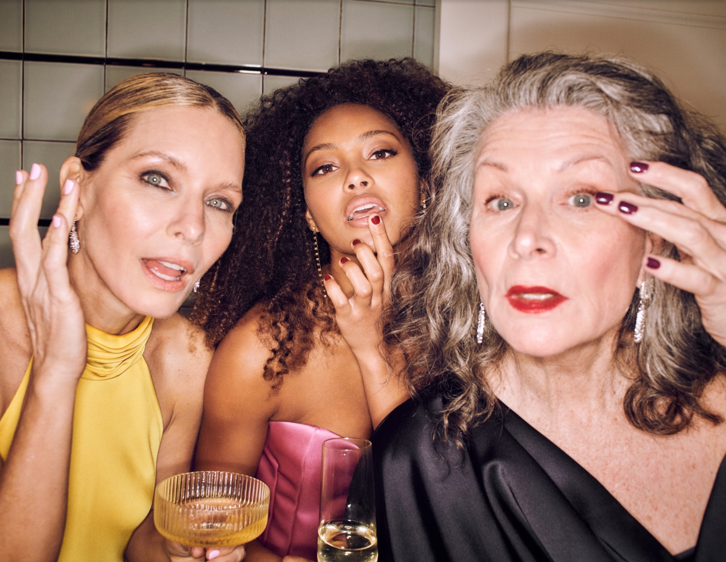 Friends getting ready together during an at-home group beauty session
