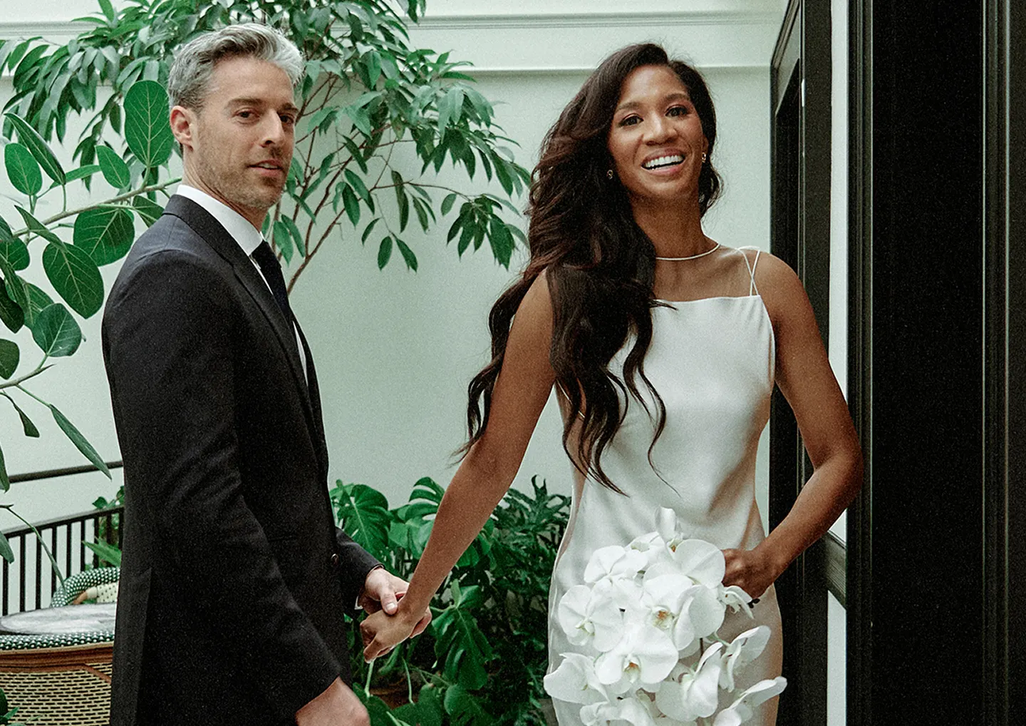Bride and partner smiling together