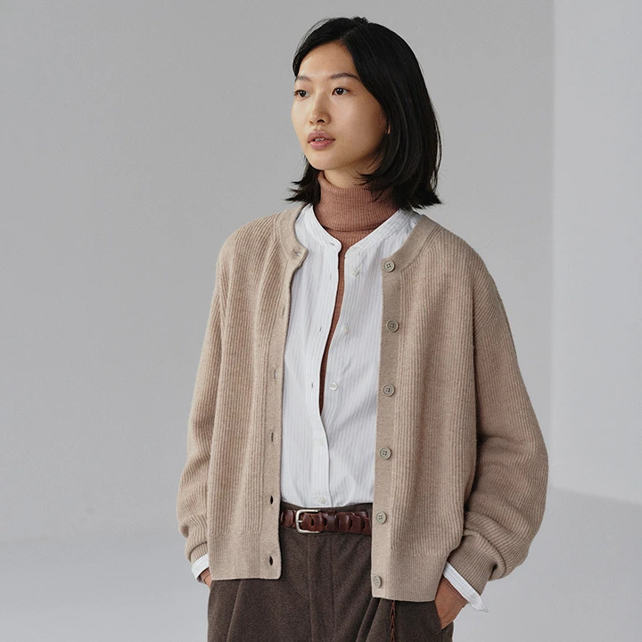 A model wearing a MUJI cardigan