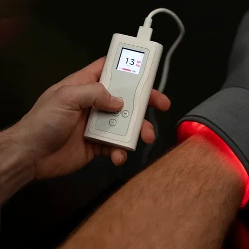 A red light cuff beside its controller
