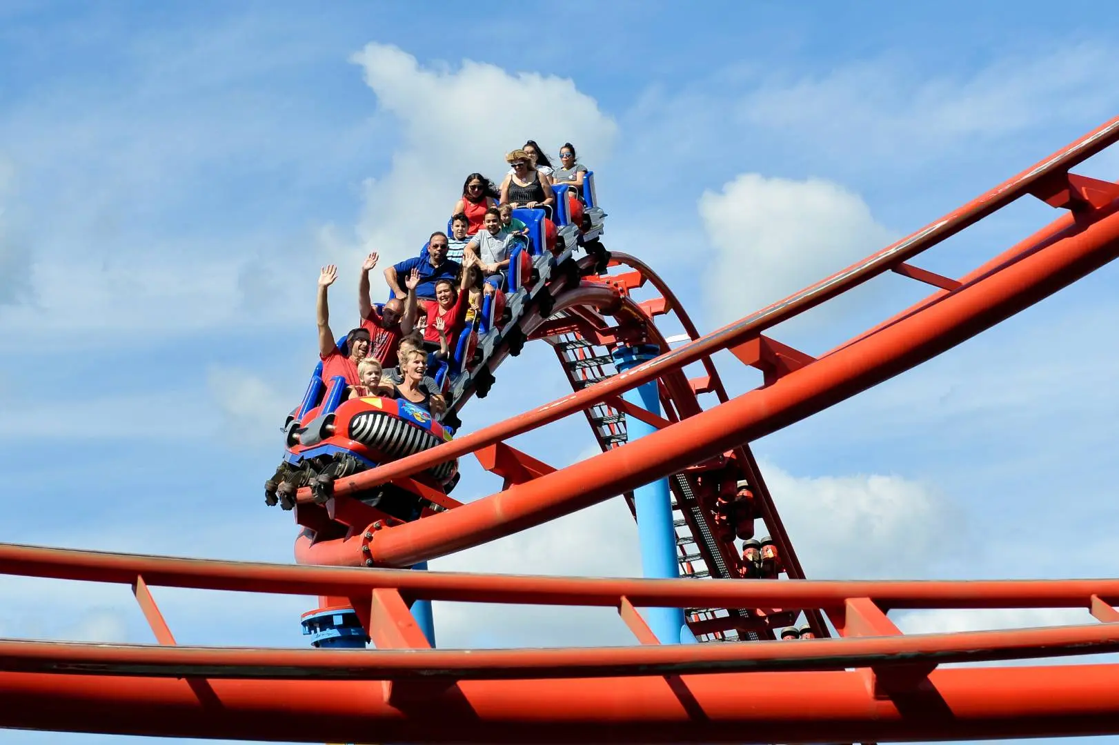 Family riding an outdoor amusement park attraction